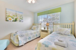 The flower room features two twin beds, a ceiling fan, 32 inch HD LED TV with internet apps, Blu-ray player, a chair that converts to an extra twin bed, Sony PS2 and large double door closets.