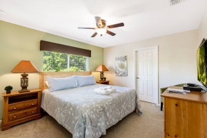 The second floor king bedroom features a King Sized Memory Foam Pillow Top Mattress,Ceiling Fan, Wall Mounted 40 inch HD LED TV with Internet Apps, Blu-ray Player, Barrel Accent Chair and a Huge Walk-in Closet