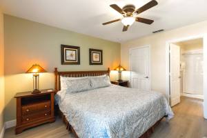 The King Bedroom features a king sized pillow top mattress, ceiling fan, 32 inch HD TV with Internet Apps, accent chair and an en suite with walk-in shower