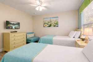 The flower room features two twin beds, a ceiling fan, 32 inch HD LED TV with internet apps, a chair that converts to an extra twin bed, and large double door closets.